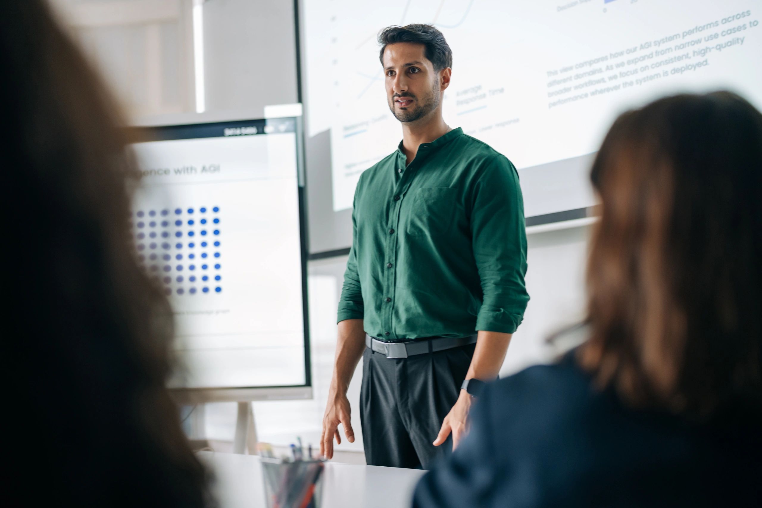 Executive presenting growth metrics during a strategy meeting